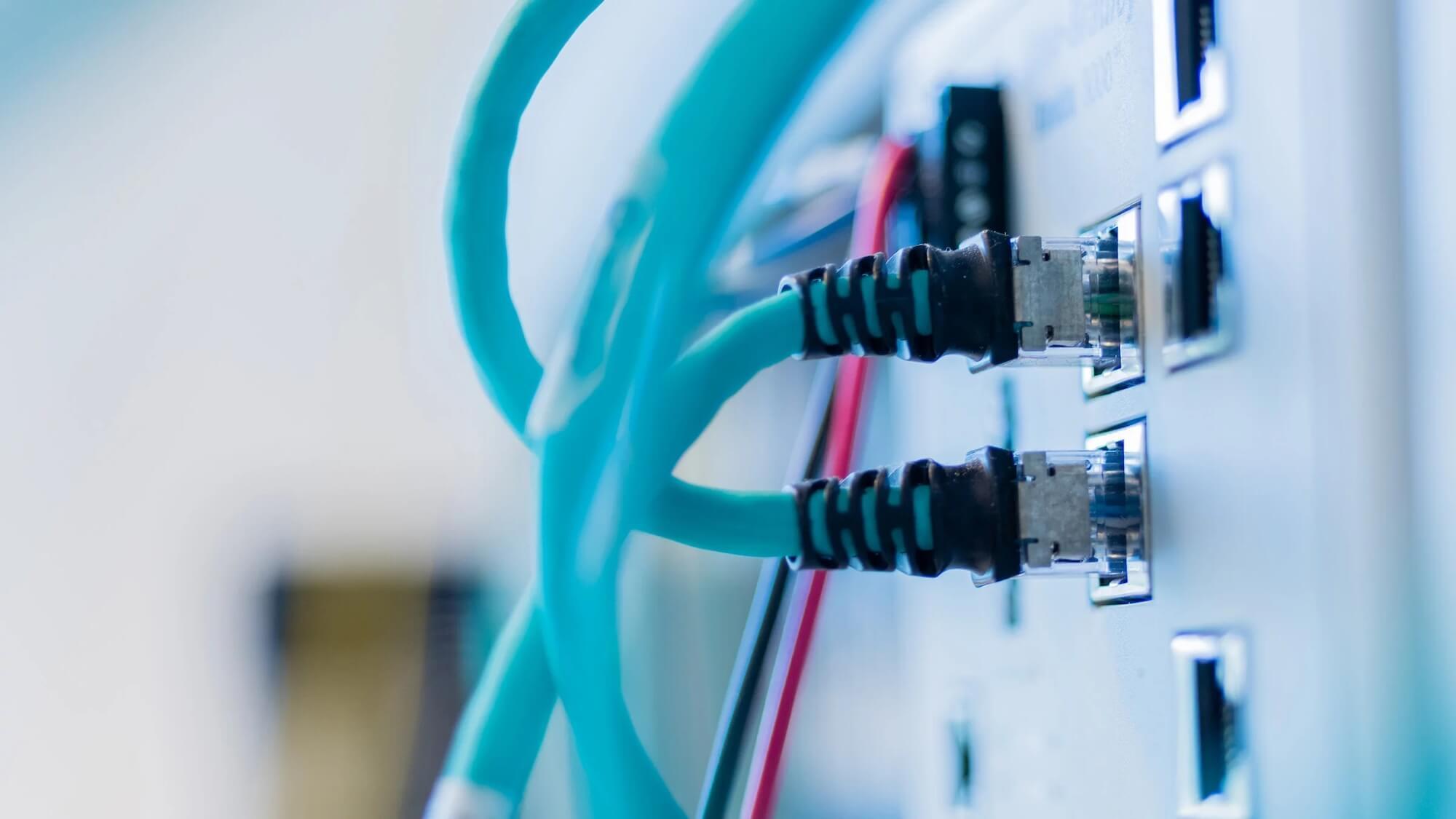 Heroshot bright blue cables plugged into device