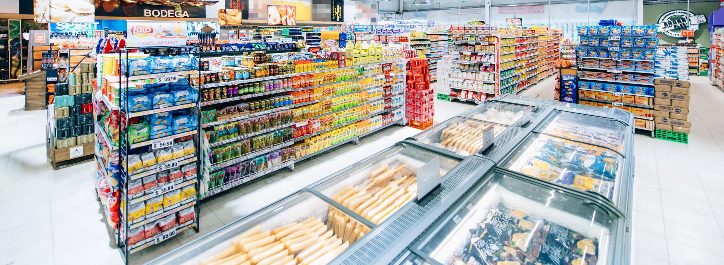 assortment of packaged consumer goods arranged in rows, illustrating SKU variety and the complexity modern plants must manage through modular automation systems